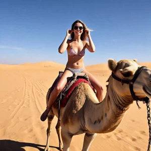 Female tourist riding a camel in Jaisalmer desert with golden dunes and traditional backdrop